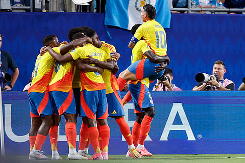Players of Colombia celebrate their side's opening goal 